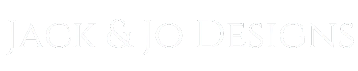 The image shows the text "Jack & Jo Designs" in elegant, serif white font on a black background, conveying a sleek and sophisticated branding.